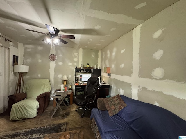 interior space with a ceiling fan and wood finished floors