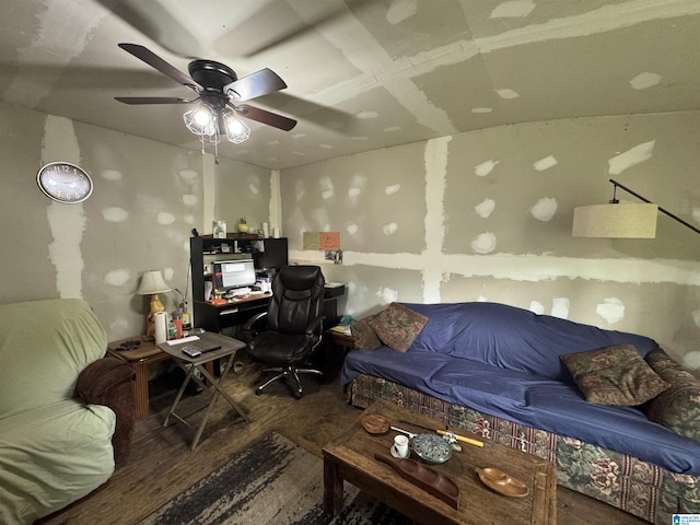 living room with a ceiling fan and wood finished floors