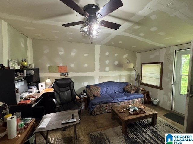 living room featuring a ceiling fan and wood finished floors