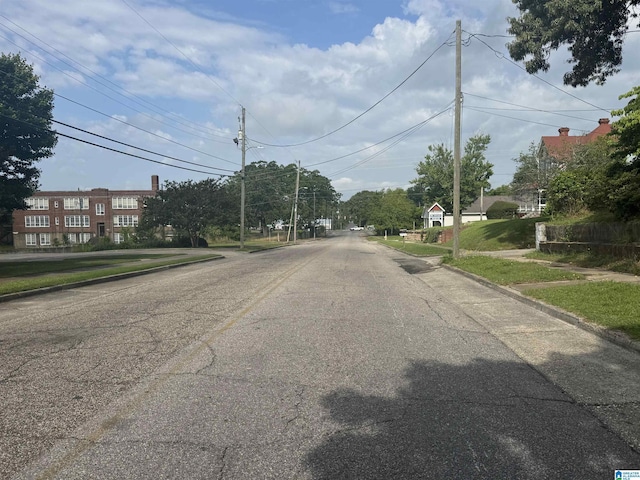 view of street featuring curbs and sidewalks