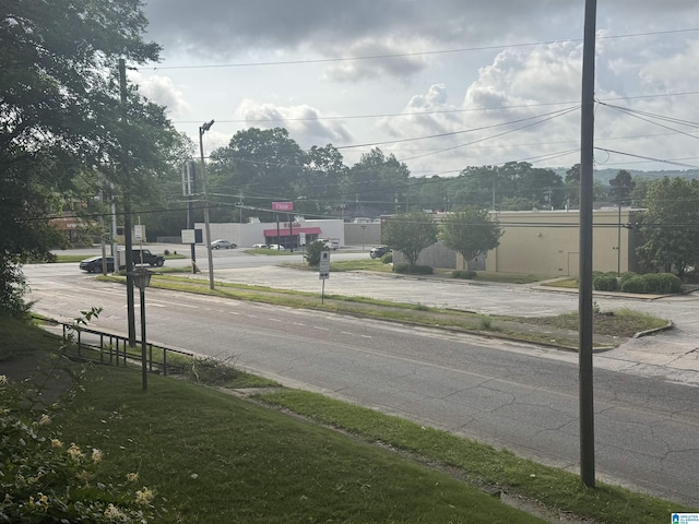 view of road featuring curbs and sidewalks