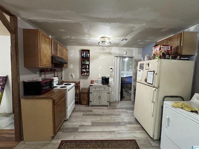 kitchen featuring brown cabinetry, washer / dryer, white appliances, light wood-type flooring, and under cabinet range hood