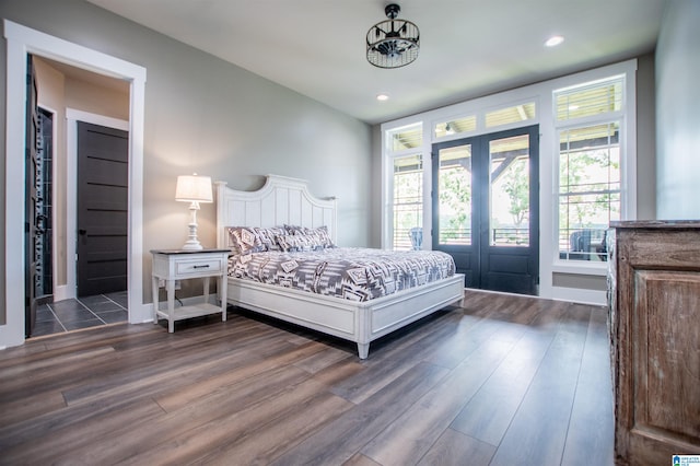 bedroom with dark wood-type flooring, recessed lighting, and multiple windows