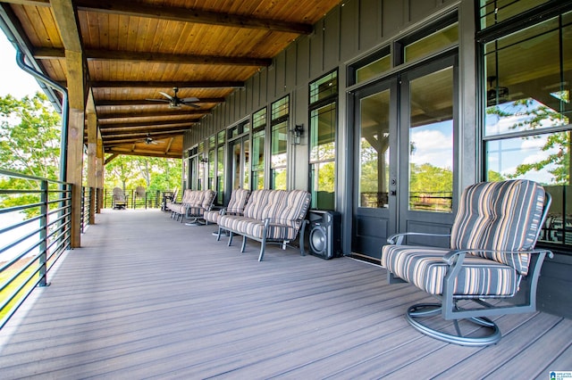 wooden deck featuring a ceiling fan