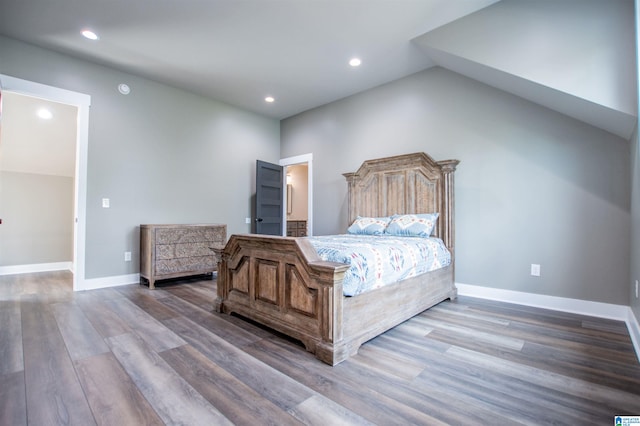 bedroom featuring baseboards, recessed lighting, and wood finished floors