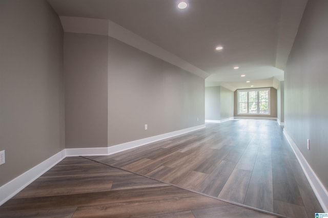 bonus room with baseboards, recessed lighting, and wood finished floors