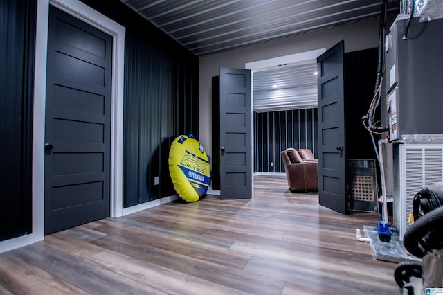 exercise room with wood finished floors