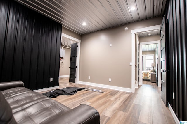 cinema room featuring recessed lighting, baseboards, and light wood finished floors