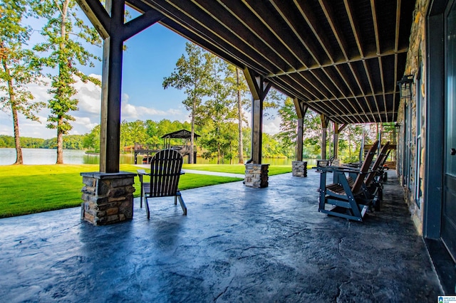 view of patio with a gazebo and a water view