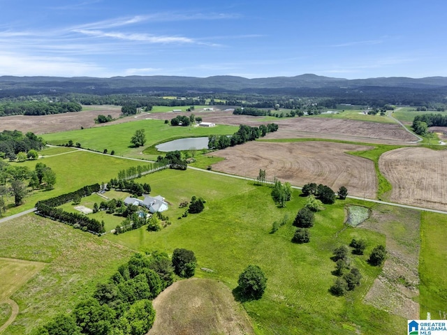 drone / aerial view with a mountain view and a rural view