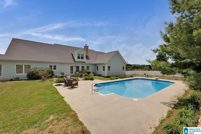 view of pool featuring a patio, a yard, fence private yard, and a fenced in pool