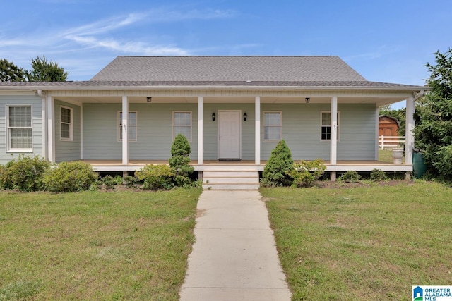 farmhouse-style home featuring a porch and a front yard
