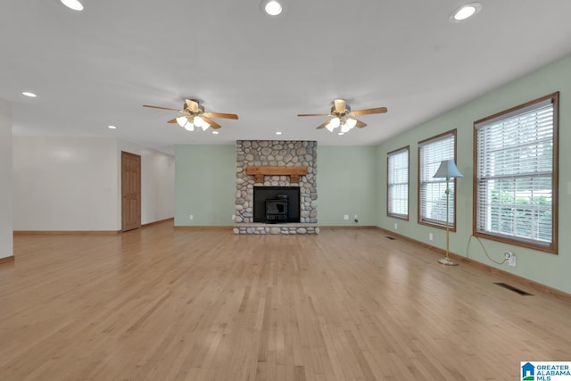 unfurnished living room featuring light wood-type flooring, a ceiling fan, and recessed lighting
