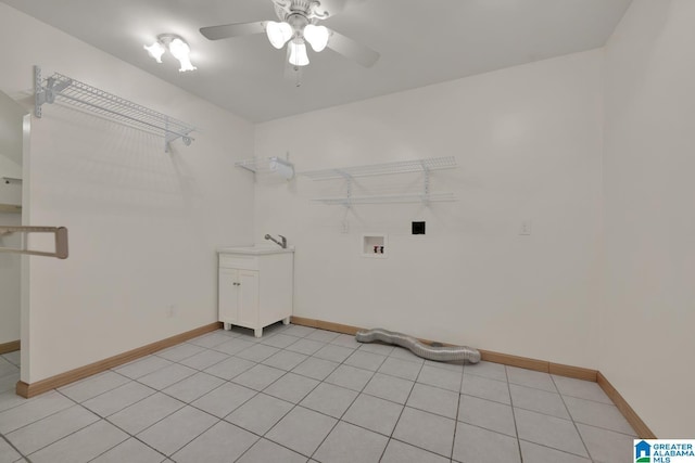 laundry room featuring baseboards, washer hookup, ceiling fan, and cabinet space