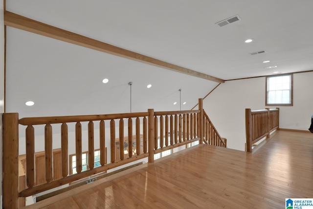 interior space with recessed lighting, baseboards, visible vents, and hardwood / wood-style flooring