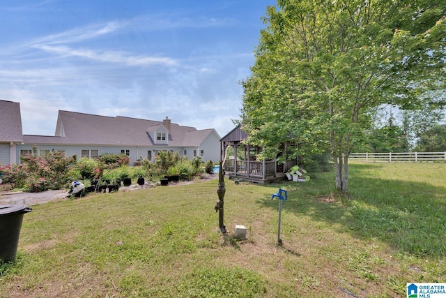view of yard featuring fence and a gazebo