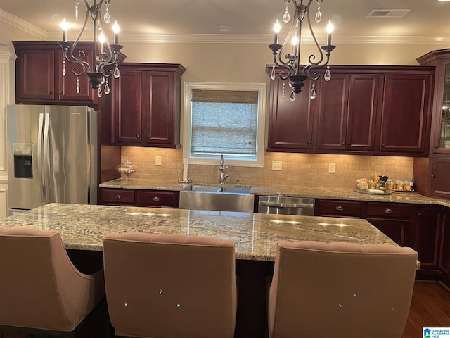 184 Grey Oaks Ct, Pelham, AL 35124 - kitchen featuring a chandelier, appliances with stainless steel finishes, a sink, light stone countertops, and crown molding