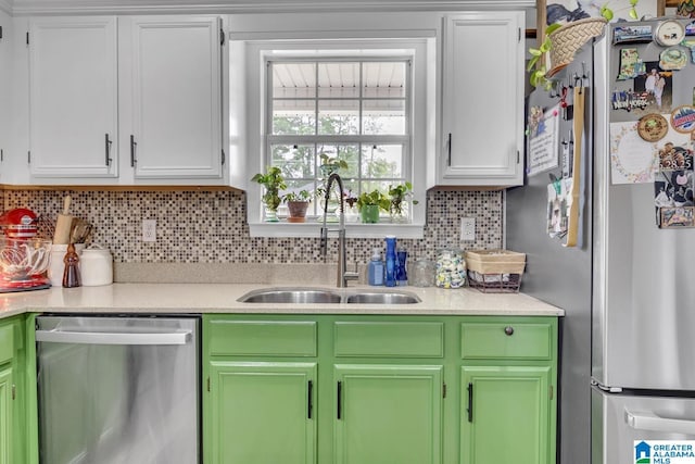 1522 Bower Dr SE, Cullman, AL 35055 - kitchen featuring a sink, appliances with stainless steel finishes, backsplash, and light countertops