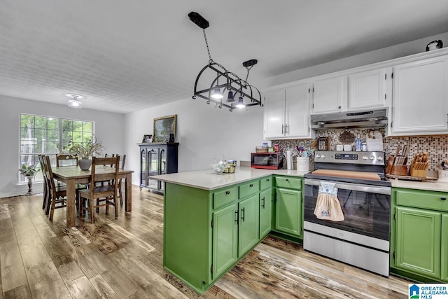 1522 Bower Dr SE, Cullman, AL 35055 - kitchen featuring a peninsula, green cabinetry, under cabinet range hood, white cabinets, and electric stove