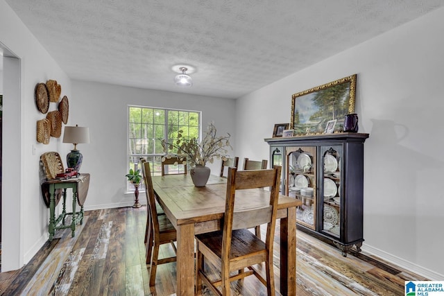 1522 Bower Dr SE, Cullman, AL 35055 - dining space with a textured ceiling, baseboards, and hardwood / wood-style floors