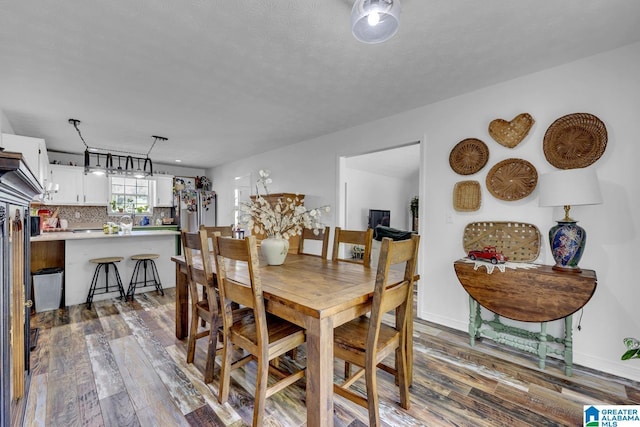 1522 Bower Dr SE, Cullman, AL 35055 - dining room with dark wood-type flooring and baseboards