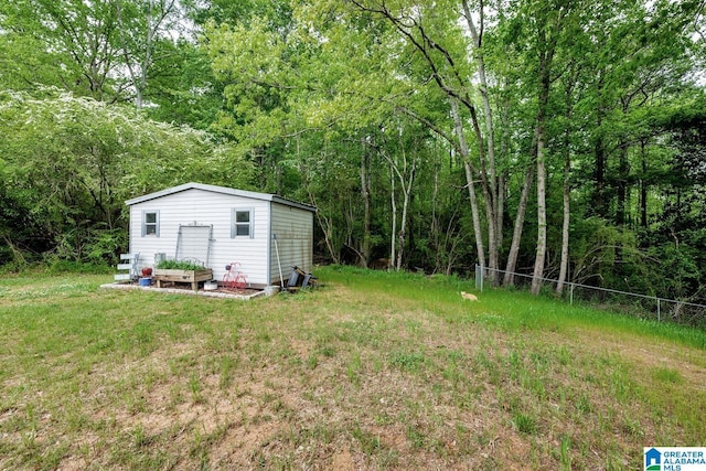 1522 Bower Dr SE, Cullman, AL 35055 - view of yard with fence, an outdoor structure, and a wooded view