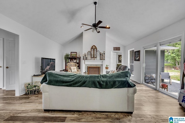 1522 Bower Dr SE, Cullman, AL 35055 - living room featuring wood finished floors, a fireplace, baseboards, high vaulted ceiling, and a ceiling fan