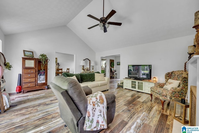 1522 Bower Dr SE, Cullman, AL 35055 - living room featuring a ceiling fan, high vaulted ceiling, and wood finished floors