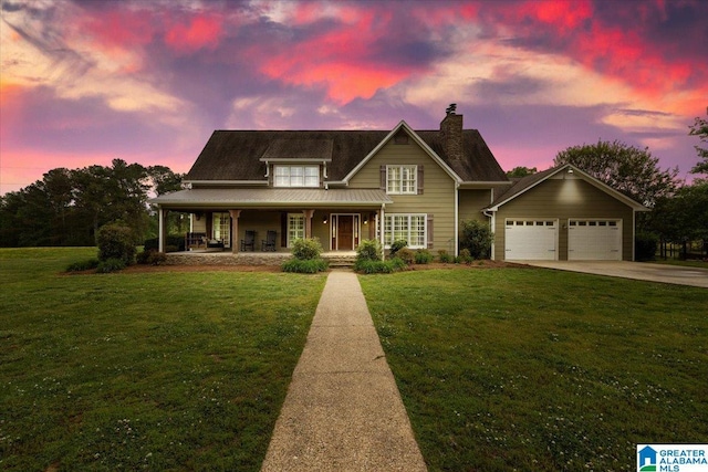 view of front of property featuring a chimney, concrete driveway, a porch, and a front yard