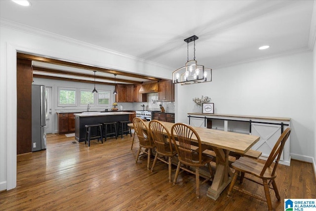 dining area with crown molding, recessed lighting, a chandelier, and dark wood-type flooring