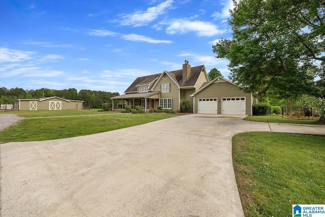 craftsman inspired home featuring a chimney, driveway, and a front yard