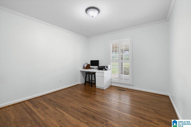 unfurnished office with baseboards, ornamental molding, and wood finished floors