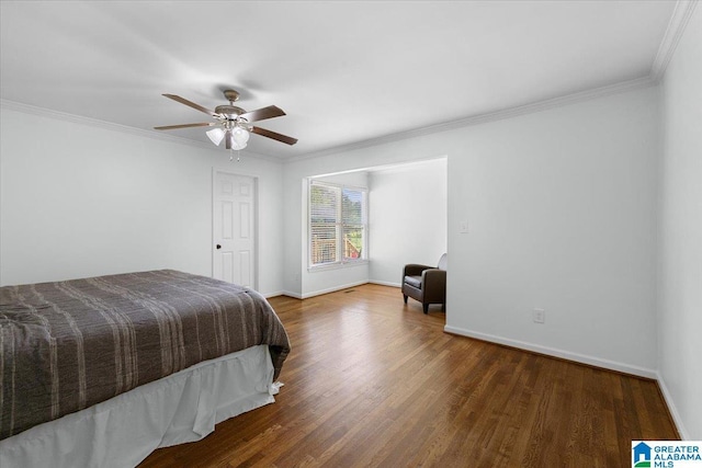 bedroom with ceiling fan, baseboards, ornamental molding, and wood finished floors