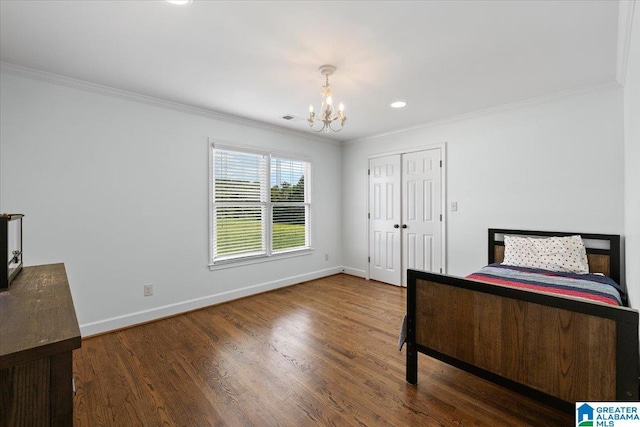 unfurnished bedroom with crown molding, baseboards, wood finished floors, and a chandelier