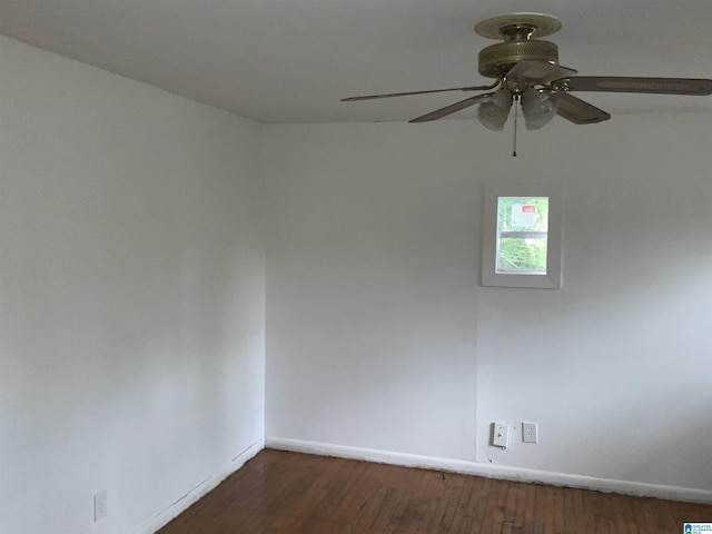unfurnished room with baseboards, a ceiling fan, and wood finished floors