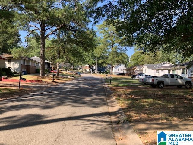 view of street featuring curbs and a residential view