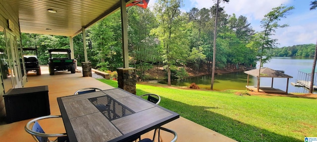 view of patio / terrace with a water view and outdoor dining area
