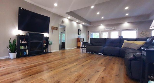 living area with recessed lighting, light wood-style flooring, and a healthy amount of sunlight