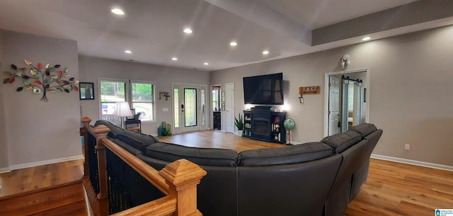 living area featuring recessed lighting and light wood-style flooring