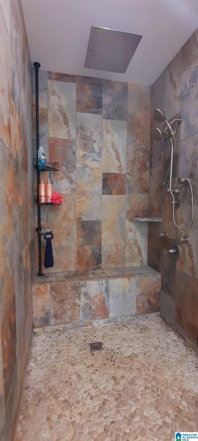 full bath featuring a tile shower