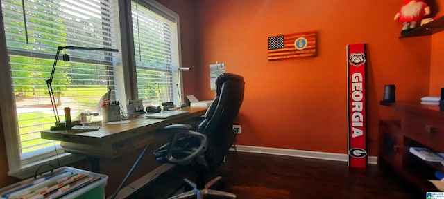 office area featuring baseboards and wood finished floors