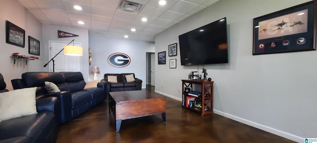 living room featuring recessed lighting, baseboards, visible vents, and finished concrete flooring