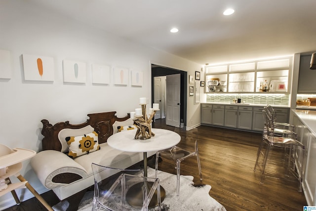 dining room with recessed lighting and dark wood-type flooring