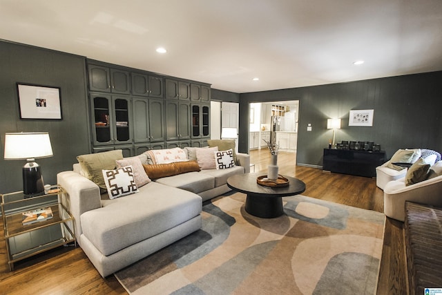 living area with recessed lighting and wood finished floors