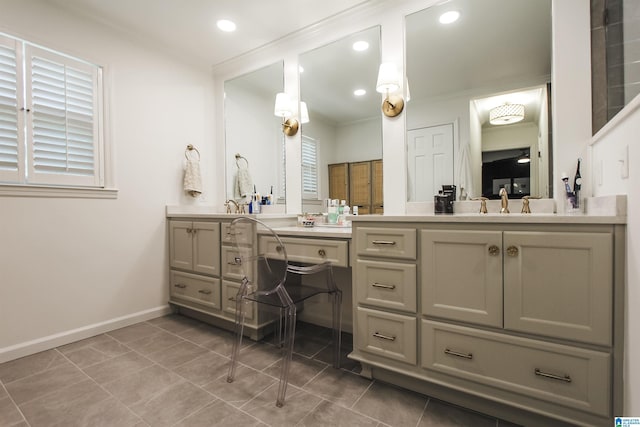 full bathroom featuring tile patterned flooring, double vanity, baseboards, recessed lighting, and a sink