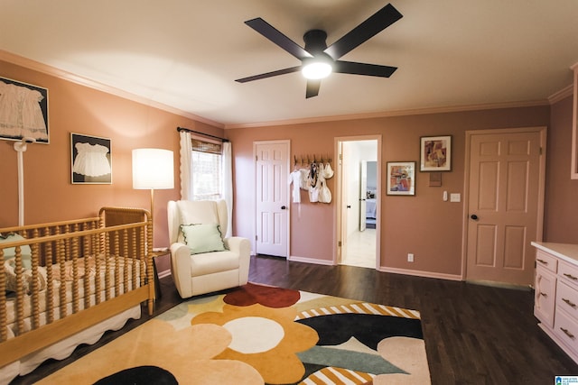 bedroom with baseboards, dark wood finished floors, ornamental molding, and ceiling fan