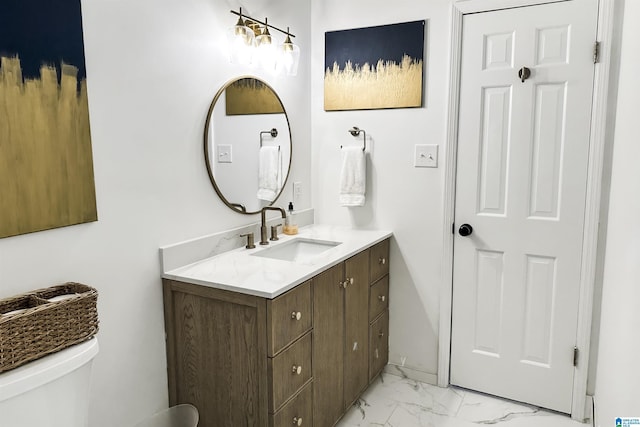 bathroom featuring vanity, marble finish floor, and toilet