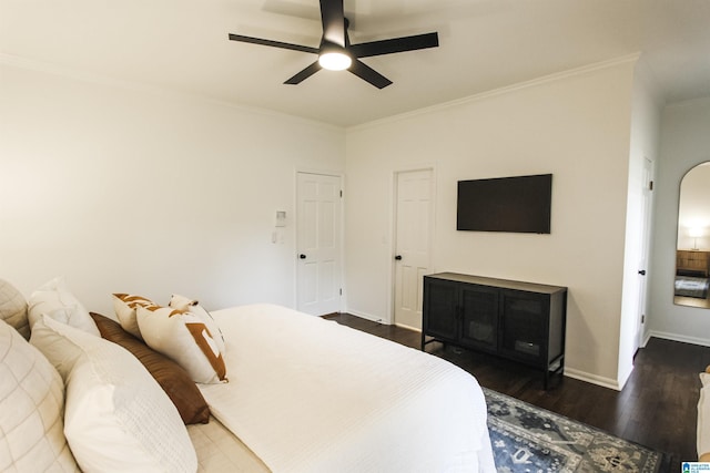 bedroom featuring ceiling fan, baseboards, ornamental molding, and wood finished floors