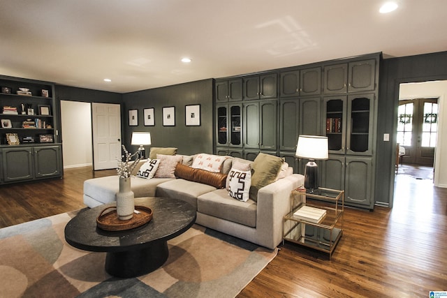 living area with recessed lighting and dark wood finished floors