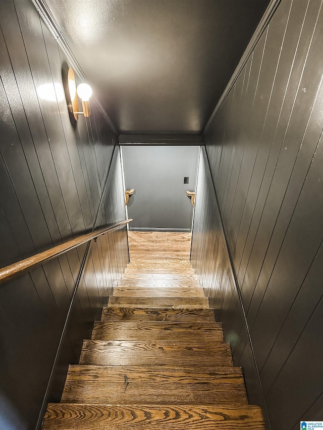 stairway featuring ornamental molding